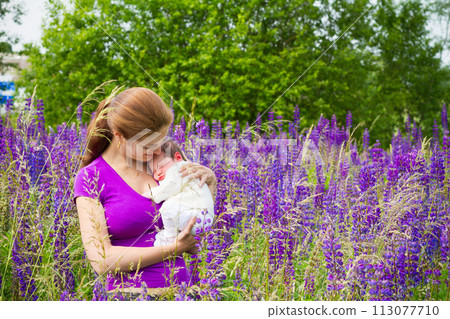 Mother and child in sunny park. Mom and baby. Mother and child in sunny park. Mom and baby. 113077710