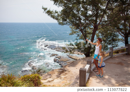 Family hiking. Mountain sea view. Travel with kids 113077822