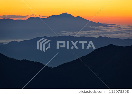 Mt. Asama at dawn seen from the Mt. Hotaka ridge in the Northern Alps Mt. Asama at dawn seen from the Mt. Hotaka ridge in the Northern Alps 113078208
