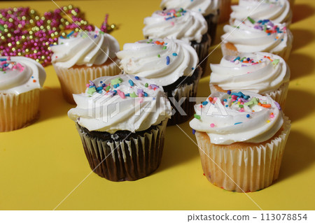 Cupcakes on Table at Party on Yellow Table Cupcakes on Table at Party on Yellow Table 113078854