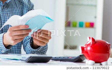 Young couple looking at family finance papers 113079022