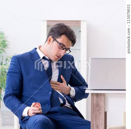Bankrupt businessman having heart attack at home Bankrupt businessman having heart attack at home 113079031