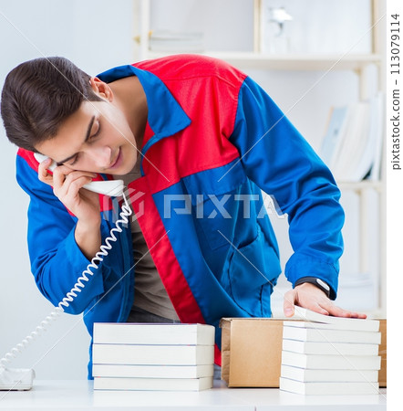 Worker in publishing house preparing book order Worker in publishing house preparing book order 113079114