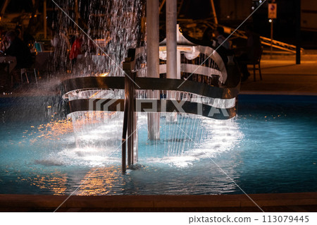 Colorful fountain with night light blurred background, 113079445