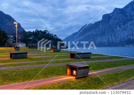 Modern design urban bench in front of the mountain lake Como Modern design urban bench in front of the mountain lake Como 113079452