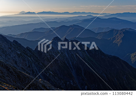 Morning view of Mt. Myojin, Mt. Fuji, and the Southern Alps from Mt. Okuhotaka in the Northern Alps 113080442