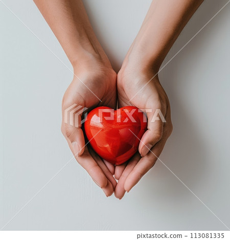 Hands holding red heart on white background. Health care or donate concept. World heart day 113081335