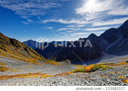Autumn leaves at Karasawa Curl in the Northern Alps and Mt. Maehotaka on the north ridge and Mt. Jonen 113082317