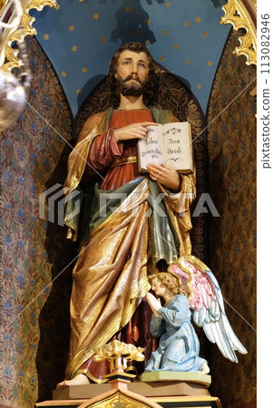 St. Matthew the Evangelist statue on the main altar in the church of Saint Matthew in Stitar, Croatia. 113082946