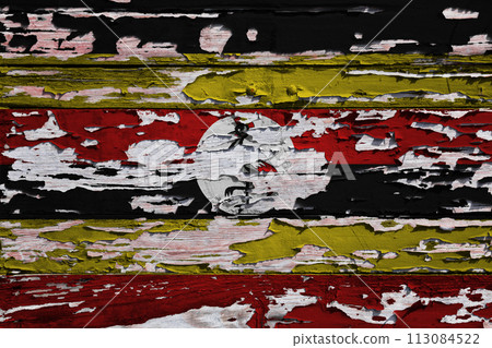 Flag of Uganda painted on a wooden board Flag of Uganda painted on a wooden board 113084522