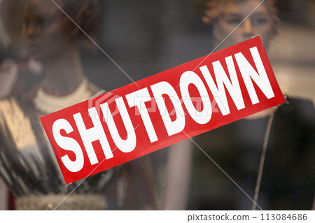 Shutdown banner in a window shop 113084686