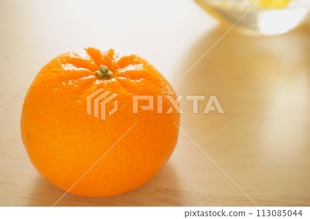 1 mandarin orange on the table Murcott 2 1 mandarin orange on the table Murcott 2 113085044