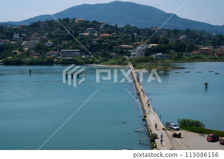 Monastery on the water, over which planes take off and land Greece Corfu island Vlacherna Monastery  113086156