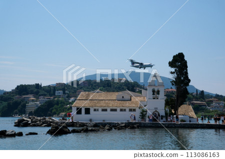Monastery on the water, over which planes take off and land Greece Corfu island Vlacherna Monastery Monastery on the water, over which planes take off and land Greece Corfu island Vlacherna Monastery 113086163