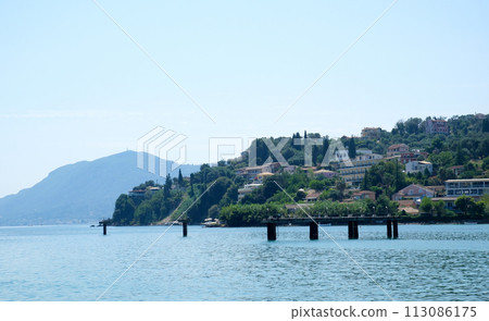 Monastery on the water, over which planes take off and land Greece Corfu island Vlacherna Monastery  113086175