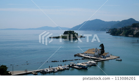 Monastery on the water, over which planes take off and land Greece Corfu island Vlacherna Monastery  113086201