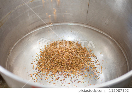 Grain in a metal bowl for bread making 113087592