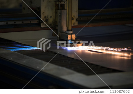 Plasma cutting of metal.Cutting of metal. Sparks fly from laser Plasma cutting of metal.Cutting of metal. Sparks fly from laser 113087602