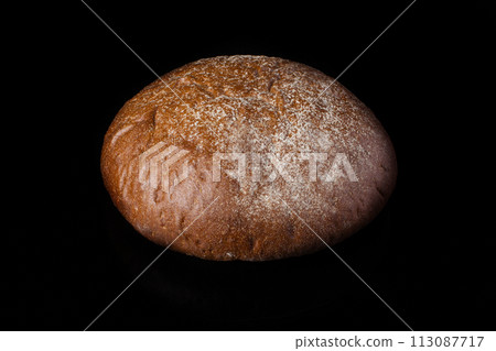 Bread on a dark background.Loaf 113087717
