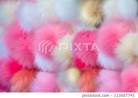 Fluffy multicolored pom-poms 113087745