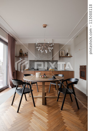 Furniture set in a dining room with hardwood flooring and table and chairs Furniture set in a dining room with hardwood flooring and table and chairs 113088118