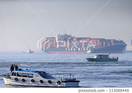 Container ship docking Container ship docking 113088440