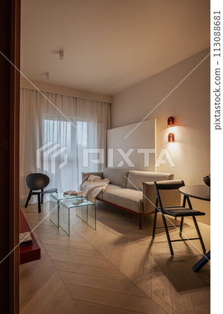 Living room with couch, table, and chairs in a house 113088681
