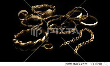 Assorted Gold Jewelry on Black Assorted Gold Jewelry on Black 113090199