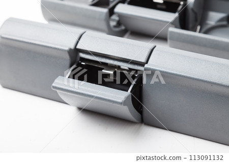 An opened ashtray from panel of car interior separately on a white isolated background with wooden decorative overlay. 113091132