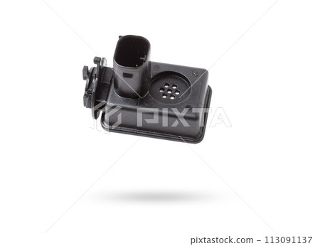 Close-up of a spare part for an air quality sensor car for replacement during repair or for sale at an auto-parsing. Close-up of a spare part for an air quality sensor car for replacement during repair or for sale at an auto-parsing. 113091137