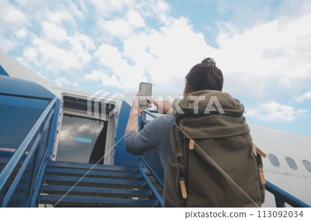 Happy attractive asian woman traveler with backpack at the modern airport terminal, copy space, Tourist journey trip concept Happy attractive asian woman traveler with backpack at the modern airport terminal, copy space, Tourist journey trip concept 113092034