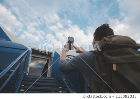 Happy attractive asian woman traveler with backpack at the modern airport terminal, copy space, Tourist journey trip concept 113092035