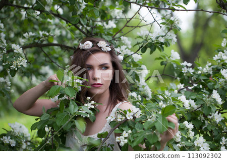 Female model healthy woman posing outdoor in spring park, closeup portrait 113092302