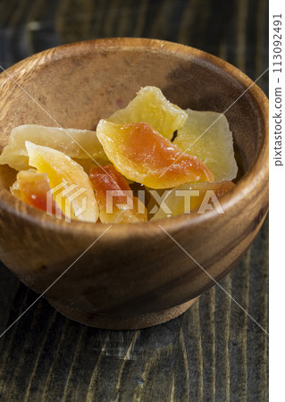 dried papaya fruits on the table dried papaya fruits on the table 113092491