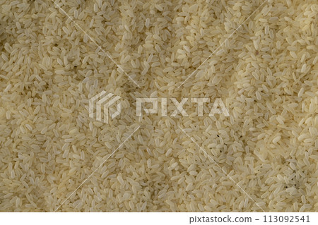 yellow peeled rice in close-up, uncooked 113092541