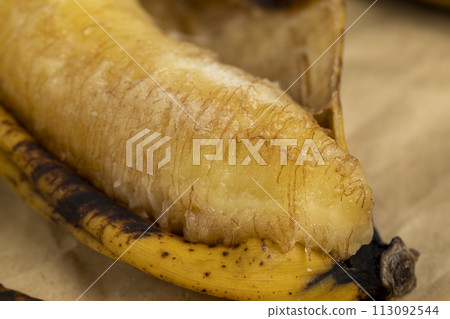 an overripe dark banana that is spoiling an overripe dark banana that is spoiling 113092544