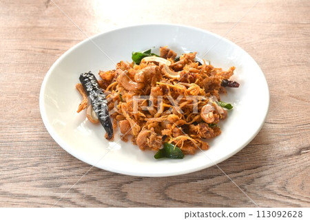 fried crispy chicken with cashew nut and chili on plate  113092628