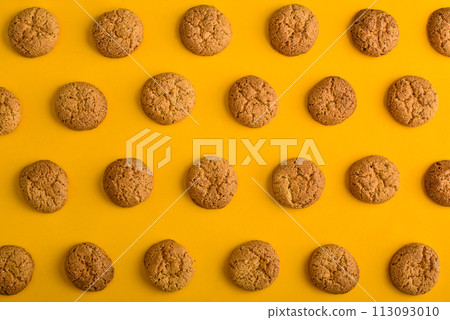 Cookies pattern on the yellow background 113093010