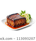 A flavorful and aromatic BBQ rib in a square glass dish, garnished with fresh herbs 113093207