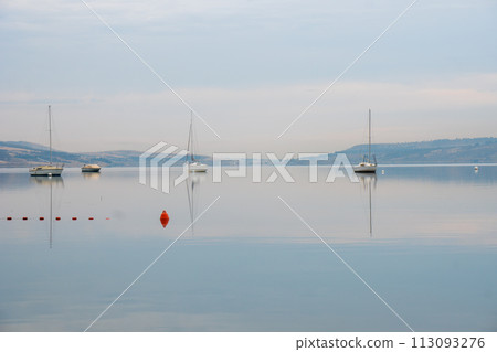 Tbilisi sea, reservoir and boats with deflated sails Tbilisi sea, reservoir and boats with deflated sails 113093276