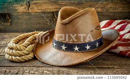 American Flag and a Cowboy Hat on an Old Wooden Table - Generative Ai 113095042