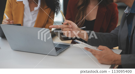 Group of Young Asian business team creative businesspeople coworker in office Happy to be successful partnership teamwork celebrating achievement and success concept. 113095400