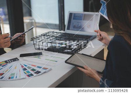 Close up ux developer and ui designer use augmented reality brainstorming about mobile app interface wireframe design on desk at modern office.Creative digital development agency 113095426