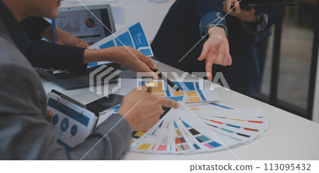 Close up ux developer and ui designer use augmented reality brainstorming about mobile app interface wireframe design on desk at modern office.Creative digital development agency 113095432