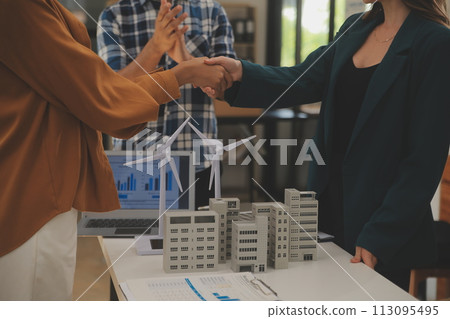 Electrical engineer with businessman discussing new project installation solar cell panel on the roof of building. Alternative energy concept. 113095495