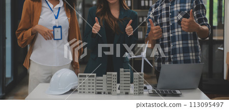 Electrical engineer with businessman discussing new project installation solar cell panel on the roof of building. Alternative energy concept. 113095497