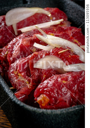 Raw Silesian beef roulades prepared for stewing. 113095936