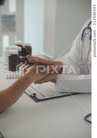 Homecare nursing service and elderly people cardiology healthcare. Close up of young hispanic female doctor nurse check mature caucasian man patient heartbeat using stethoscope during visit 113096593