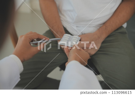 Male diseases. Man presses hands to his groin and suffering from pain, panorama, cropped, studio shot 113096615