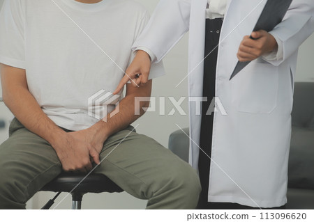 Male diseases. Man presses hands to his groin and suffering from pain, panorama, cropped, studio shot 113096620